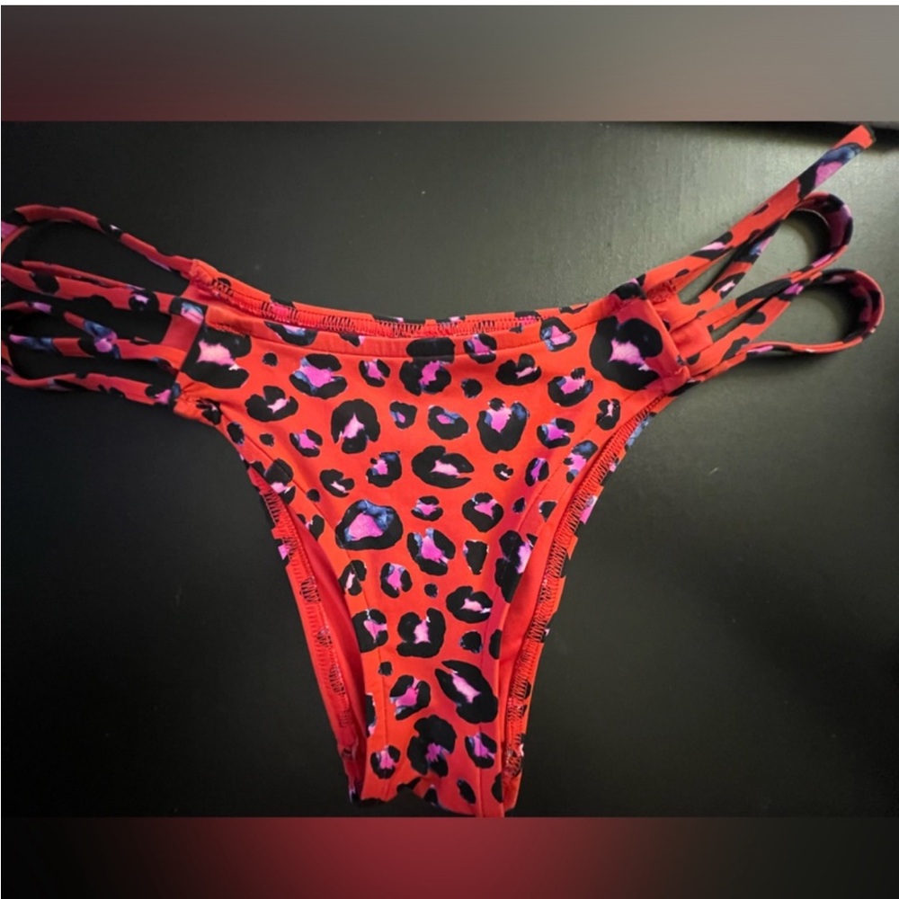 Leopard swimming suit bottoms - cheeky! Large but fit more like a medium/large!